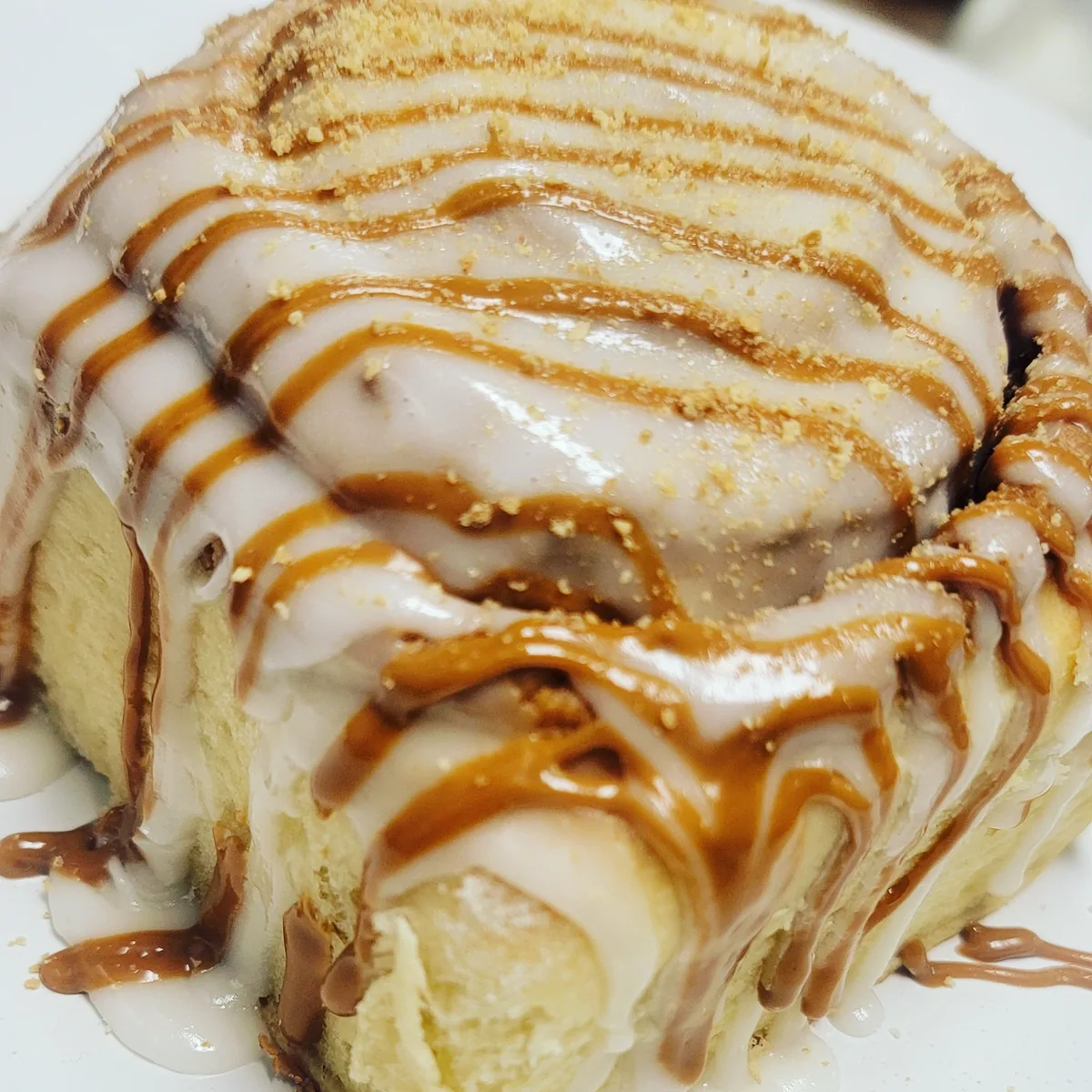 Photo placeholder: warm cinnamon roll in a bowl topped with vanilla ice cream and icing