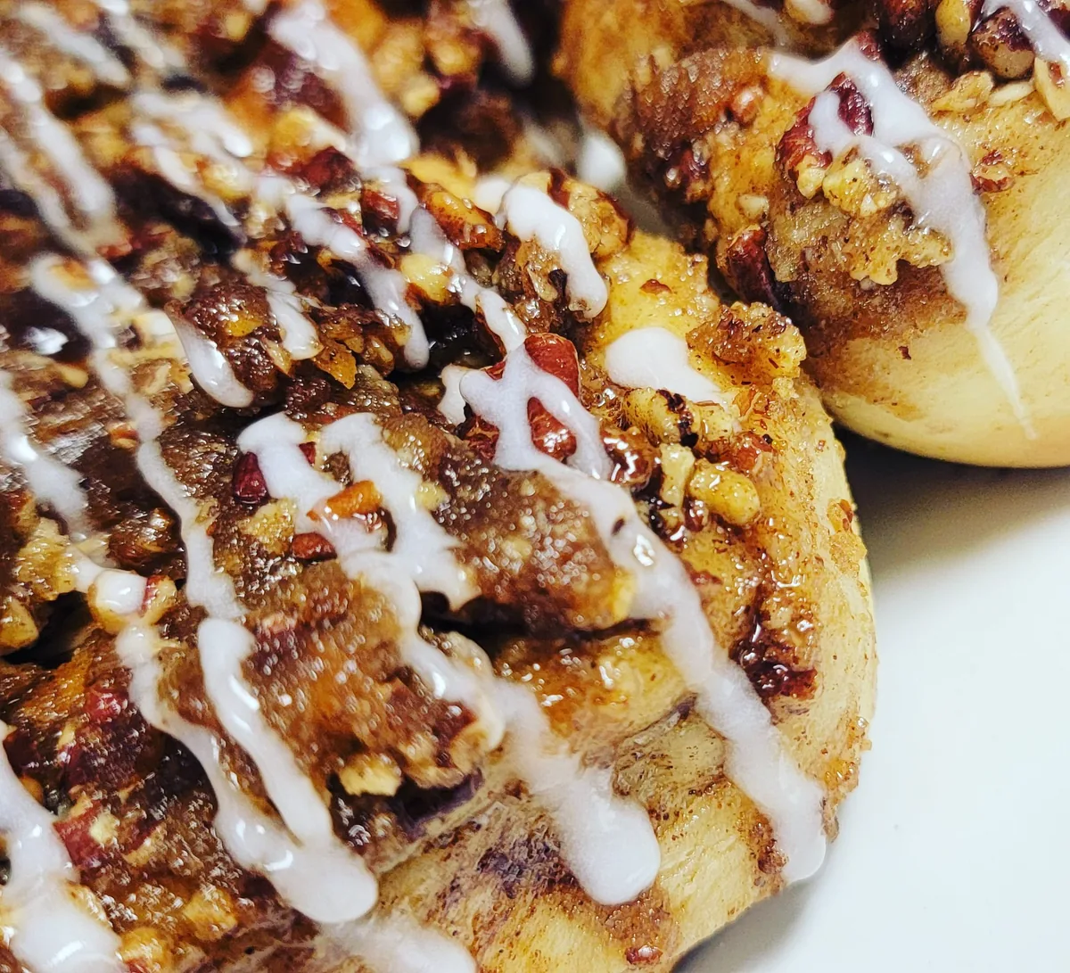 Photo placeholder: cinnamon roll French toast halves griddled golden, icing melting on top