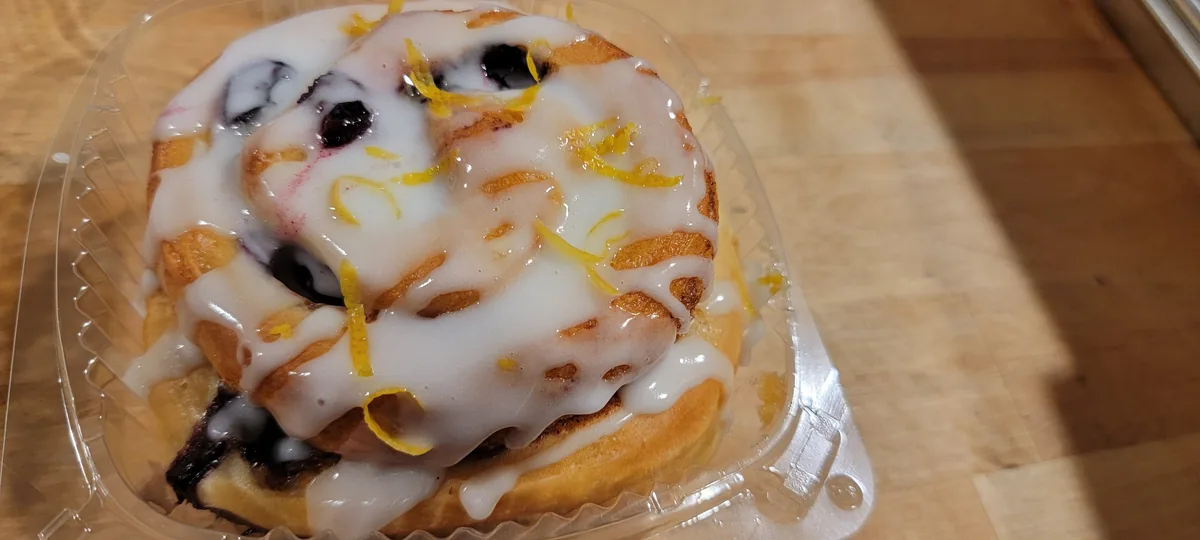Photo placeholder: cinnamon roll s'more with toasted marshmallow and melting chocolate